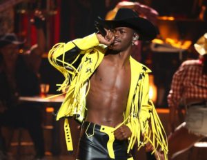 Lil Nas X performing "Old Town Road" in his yellow fringe jacket at the BET Awards.