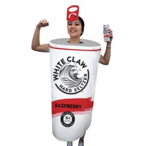 Girl in costume, dressed as a white claw can.