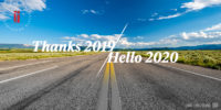 An open road and clear blue skies with the words Thanks 2019, Hello 2020 superimposed