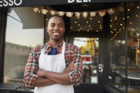 A Los Angeles Black owned business, with the owner standing in front