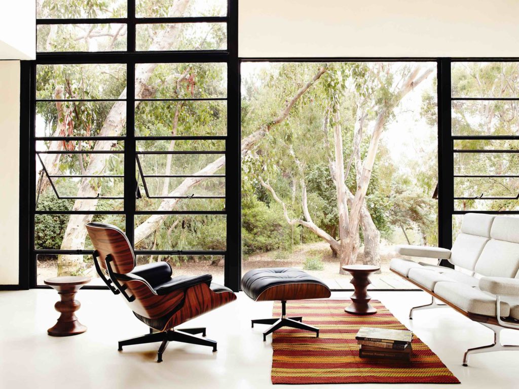 a home with vintage furniture, including an Eames lounge chair.