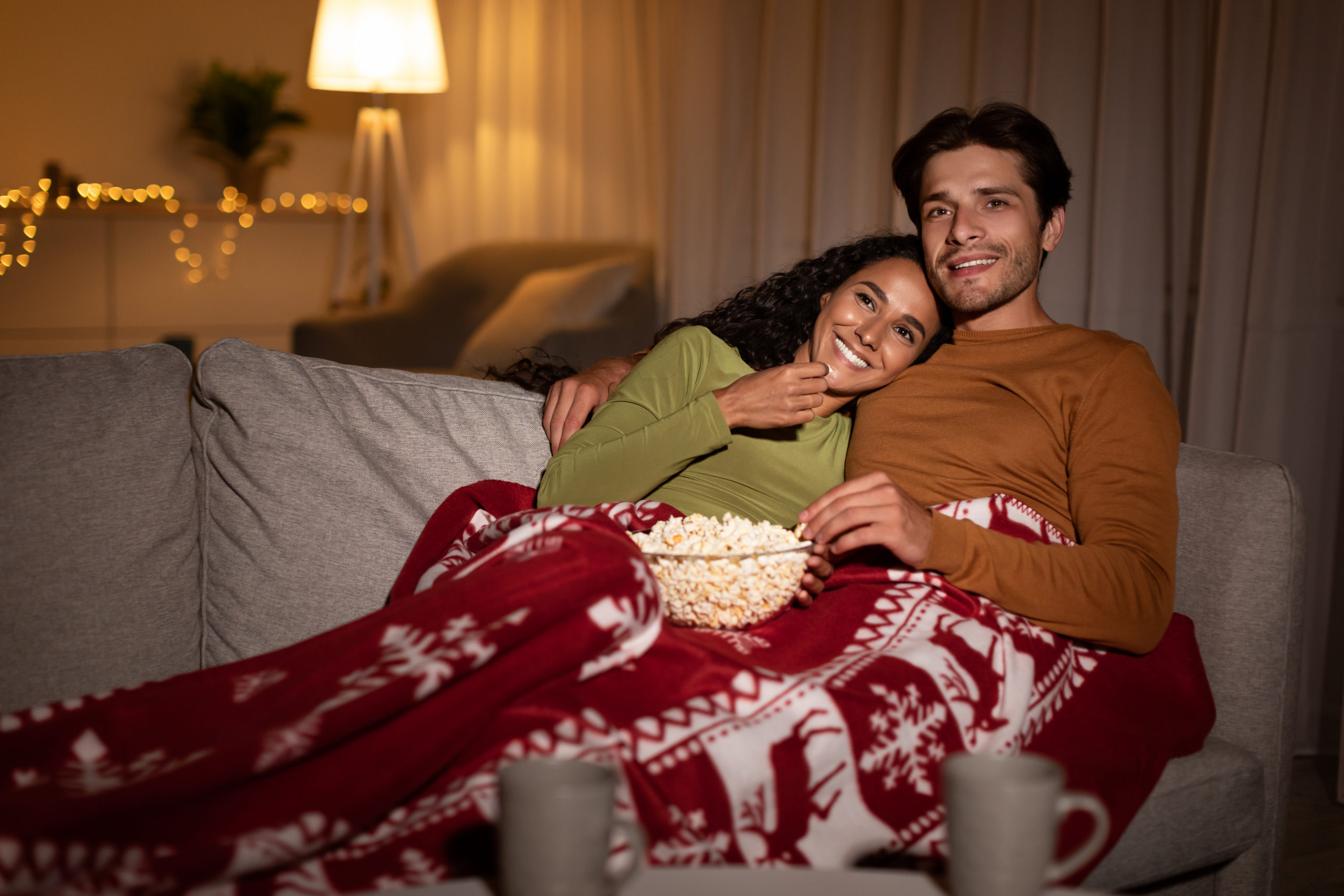 couple watching must-watch christmas classic movies