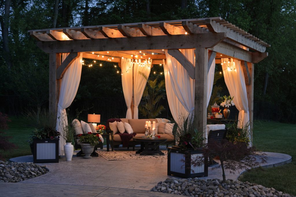 Beautiful backyard with gazebo, lights, and cozy atmosphere.