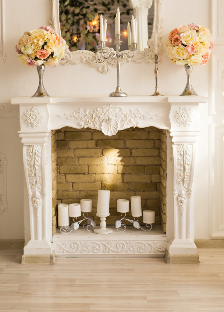 decorated fireplace with brick and mantle authorized by california building code