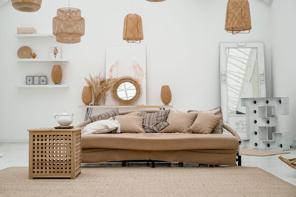 Beige and tan furniture with white walls and wood finishes throughout.