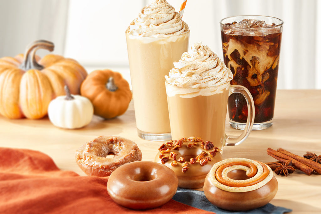Krispy Kreme lineup of their fall specialty drinks which includes an iced pumpkin coffee, hot pumpkin latte, and frozen pumpkin latte