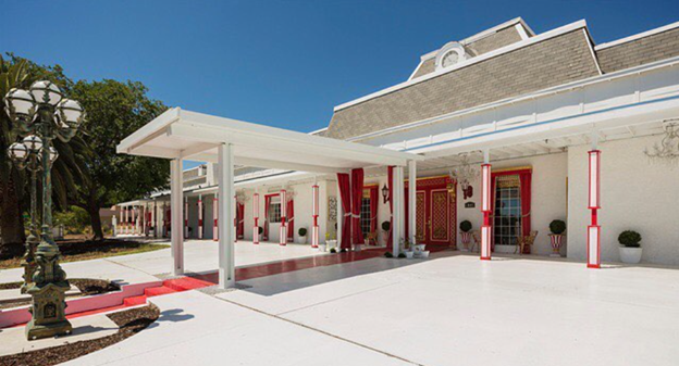 Hartland Mansion was the largest of Las Vegas mansions for decades pictured with red entryway